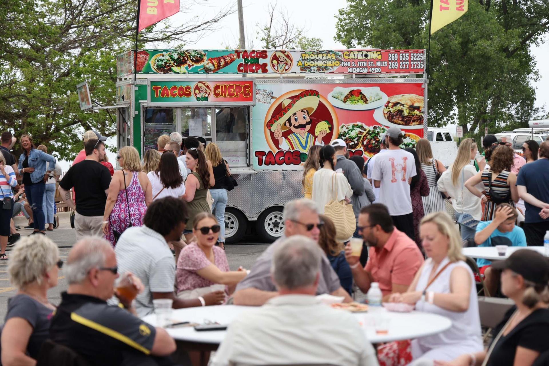 Savor diverse culinary delights from food trucks at Michigan's summer food festivals.